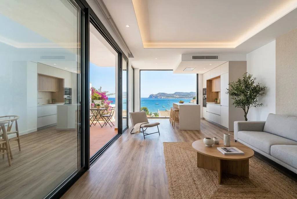 Completed apartment renovation with open plan living room and sea view balcony